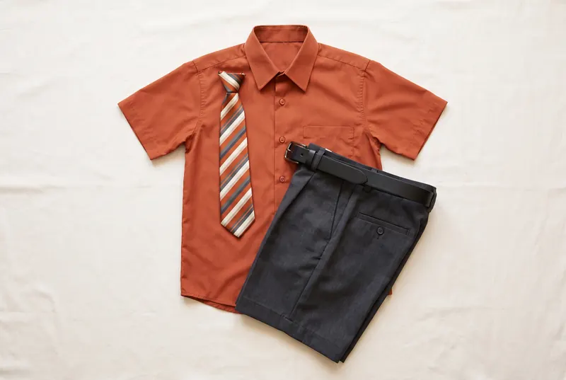 The Kaylz Academy uniform laid out: shirt, tie, short trousers and belt.